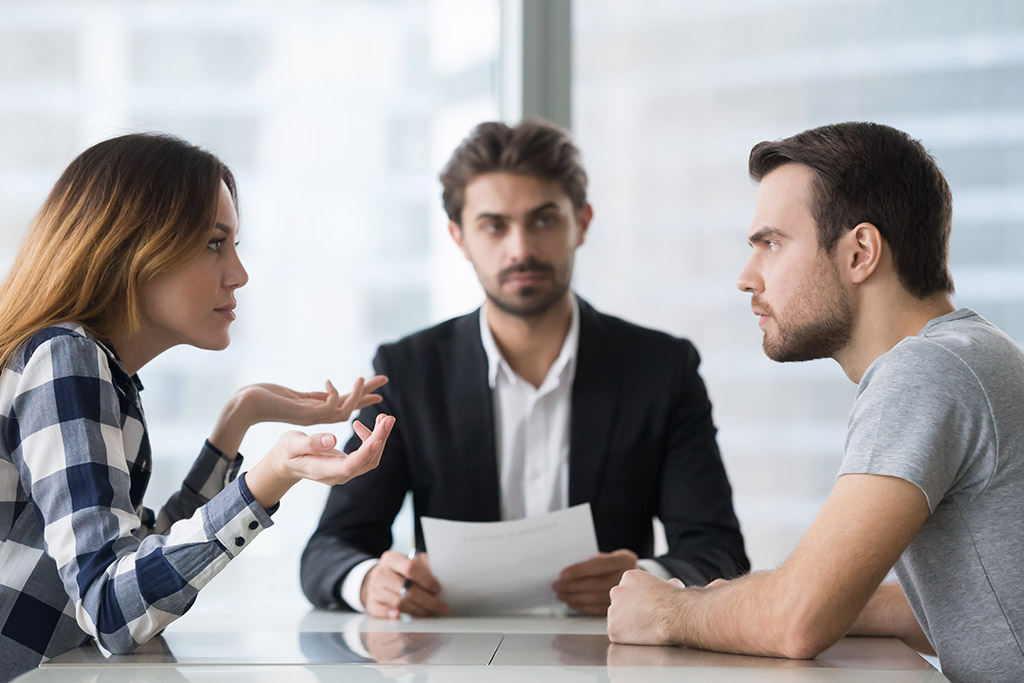 Mediator facilitating a dispute resolution meeting between two parties during a mediation and negotiation process in South Africa.